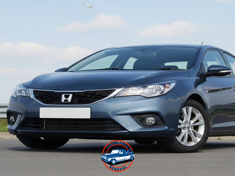 Front view of a blue Honda sedan parked on a road under a clear sky, representing a vehicle ready for scrap auto removal. Checklist When Selling a Car