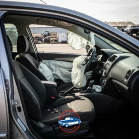 Vehicle interior damage with deployed airbags visible